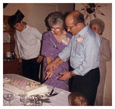 Jay and Olive cutting cake