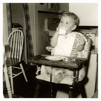 Curt in a high chair