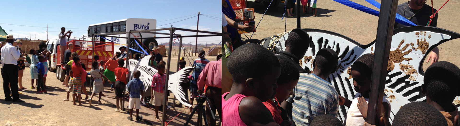 Images depict children from the community interacting with the fish. The image on the right shows a close-up of children placing mud handprints onto the fish.