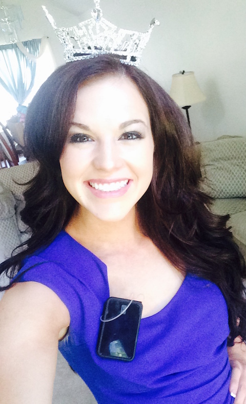 A selfie of Miss Idaho 2014 Sierra Sandison wearing a pageant crown. Her insulin pump is visible, attached to her purple dress.