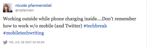 Image of a tweet that reads: "Working outside while phone charging inside...Don't remember how to work without mobile (and Twitter) #techbreak #mobiletechwriting"