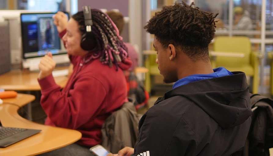 Student using headphones and jamming out