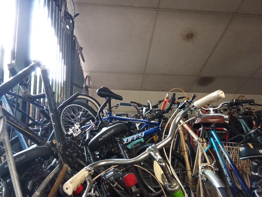A pile of unwanted bikes ready for repair.
